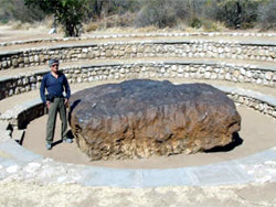 Bill posing beside the Hoba Meteorite